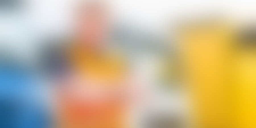 Logistics – proud driver or forwarder in front of trucks and tra